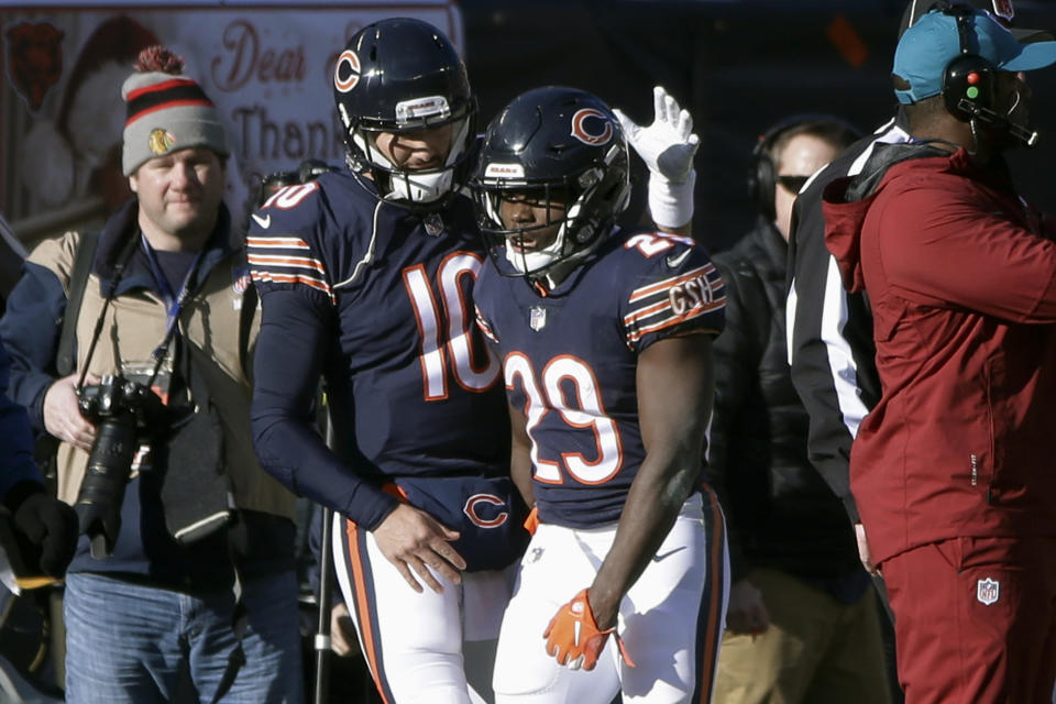 Chicago Bears quarterback Mitchell Trubisky (10) and running back Tarik Cohen (29) celebrate a touchdown during the first half of an NFL football game against the Green Bay Packers Sunday, Dec. 16, 2018, in Chicago. (AP Photo/David Banks)