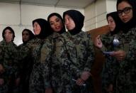 Female soldiers from the Afghan National Army (ANA) wait to get food at the Kabul Military Training Centre (KMTC) in Kabul, Afghanistan October 23, 2016. REUTERS/Mohammad Ismail