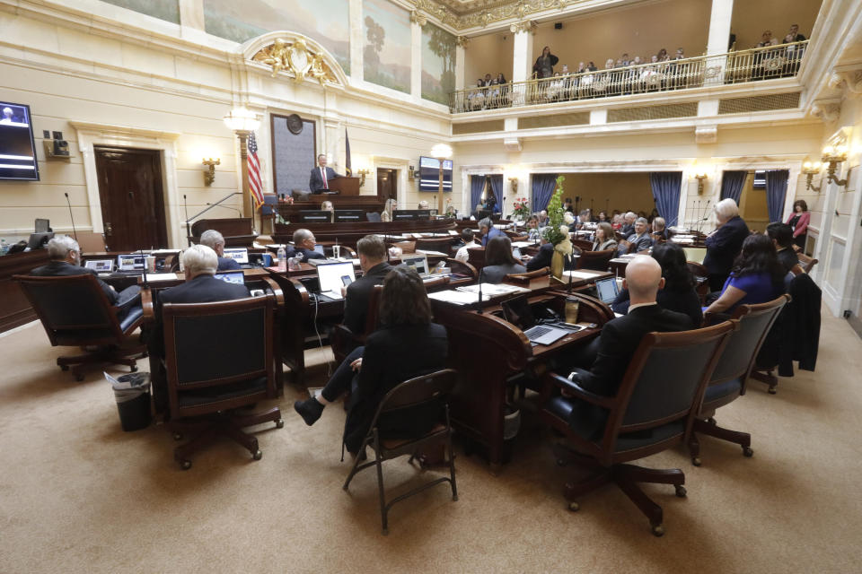 FILE - In this Jan. 27, 2020, file photo, the Utah Senate floor is viewed during the Utah legislative session in Salt Lake City. The Utah Legislature is wrapping up its work for the year, capping off a session that saw major changes to the state's polygamy statute, a revision of a voter-approved redistricting law and a compromise on education funding. The 45-day meeting is ending in the shadow of the new coronavirus, which caused widespread cancellations but didn't cause major disruptions in legislative business. (AP Photo/Rick Bowmer)