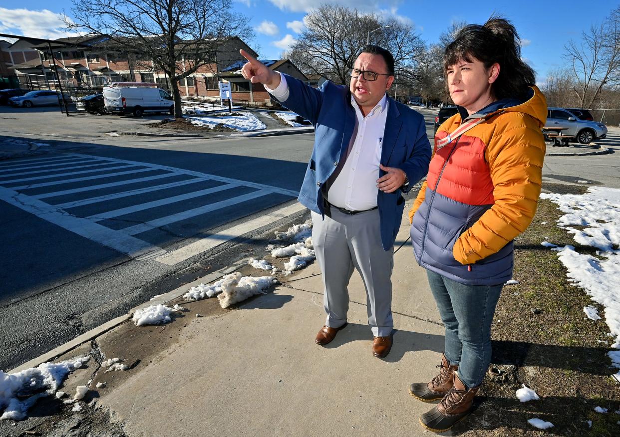 Worcester Housing Authority CEO Alex Corrales gives City Councilor Jenny Pacillo a tour of Great Brook Valley homes.