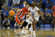 Princeton guard Kaitlyn Chen, left, loses the ball as UCLA guard Charisma Osborne, right, defends during the second half of an NCAA college basketball game, Friday, Nov. 17, 2023, in Los Angeles. (AP Photo/Ryan Sun)
