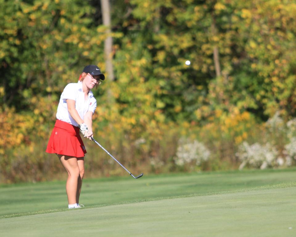 Utica's Olivia Dickson chips onto the No. 16 green during the Division II district tournament at Darby Creek on Monday, Oct. 2, 2023.