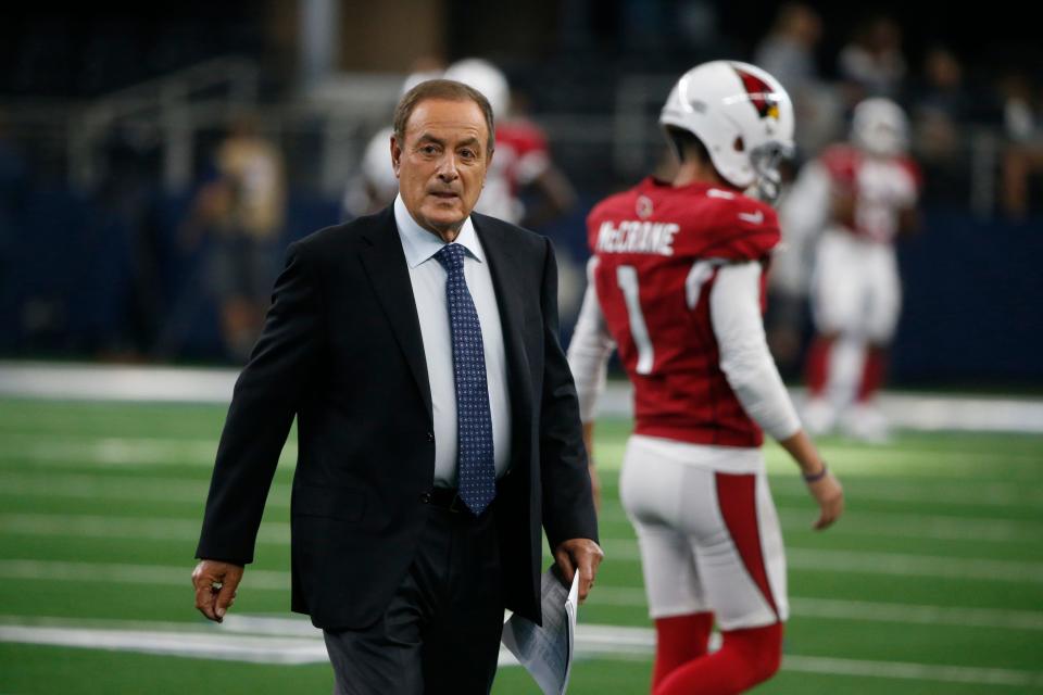 Al Michaels walks on the field before an preseason NFL football game between the Dallas Cowboys and the Arizona Cardinals in Arlington, Texas, Sunday, Aug. 26, 2018. (AP Photo/Michael Ainsworth)