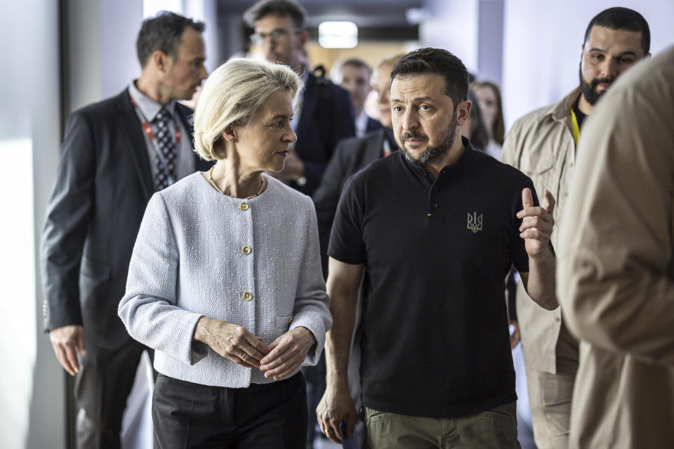 Ursula Von der Leyen, President of the European Commission, left, walks with Ukrainian President Volodymyr Zelenskyy at the Summit on Peace in Ukraine, in Obbürgen, Switzerland, Sunday, June 16, 2024. (Michael Buholzer/Keystone via AP)