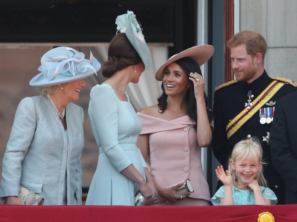 Camilla, the Queen Consort, Kate Middleton, Meghan Markle, and Prince Harry on the balcony of Buckingham Palace, in central London, following the Trooping the Colour ceremony at Horse Guards Parade on June 9, 2018.