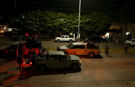 Soldiers stand guard near a safe house and crime scene where people were shot dead during an operation to recapture the world's top drug lord Joaquin "El Chapo" Guzman in Los Mochis, Mexico, January 9, 2016. REUTERS/Stringer