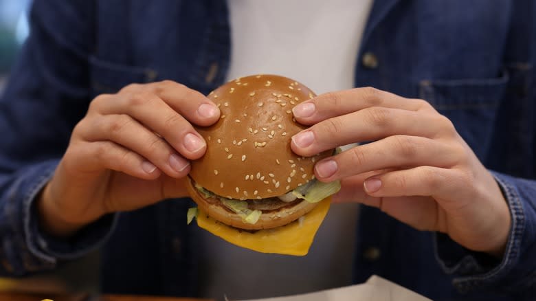 Person eating a mcdonald's burger
