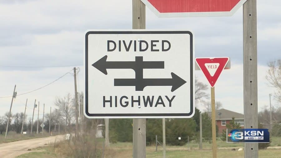 A divided highway sign and a yield sign along Kansas Highway 254 (KSN News Photo)