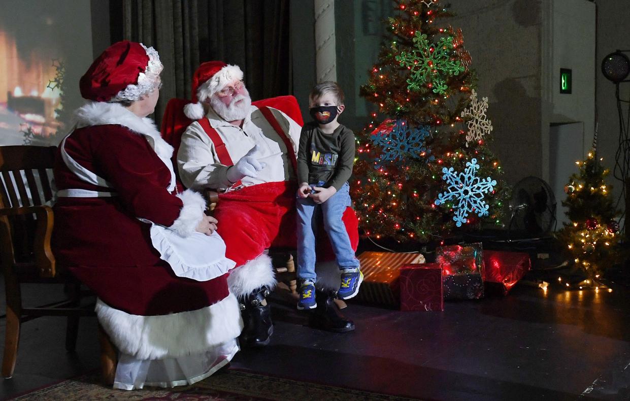 Arlo Coughlin, 4, shares his Christmas wishes with Santa Claus and Mrs. Claus during Nevada's Christmas on Main on Saturday, Dec. 11, 2021, in Nevada, Iowa.