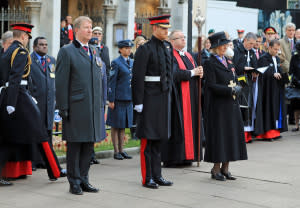 Prince Harry stands at attention at Field of Remembrance ceremony