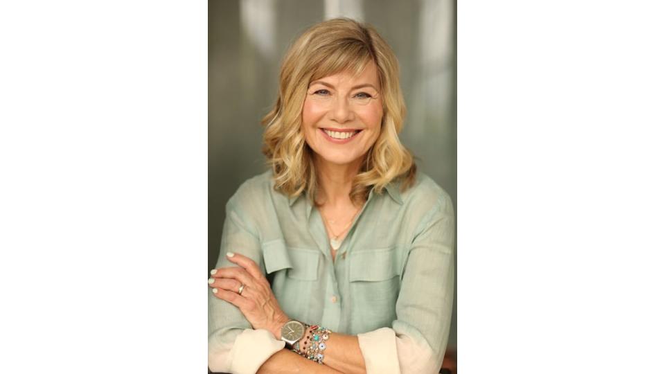 Smiling woman in a green shirt