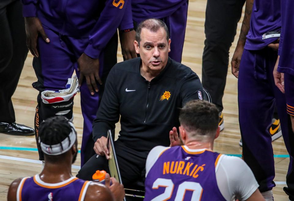 Phoenix Suns head coach Frank Vogel talks to his players during a timeout in the fourth quarter of their preseason game at Acrisure Arena in Palm Desert, Calif., Thursday, Oct. 19, 2023.