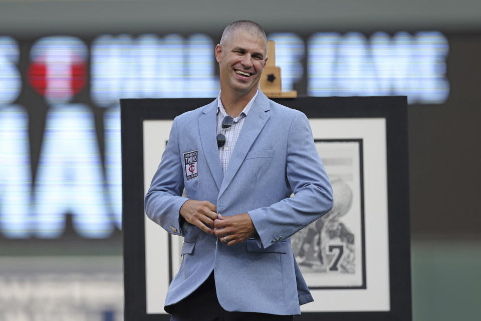 FILE - Former Minnesota Twins' Joe Mauer smiles during the ceremony inducting him into the Minnesota Twins Hall of Fame prior to the start a baseball game against the Arizona Diamondbacks, Saturday, Aug. 5, 2023, in Minneapolis. Adrián Beltré, Joe Mauer, Todd Helton and Billy Wagner could be elected to the Hall of Fame on Tuesday, Jan. 23, 2024, which could mark the fourth time in a decade that the Baseball Writers' Association of America elected four members. (AP Photo/Stacy Bengs, File)