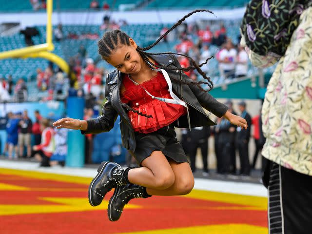 <p>Jose Carlos Fajardo/MediaNews Group/The Mercury News/Getty</p> Jay-Z photographs his daughter Blue Ivy Carter as she jumps in the end zone before the start of Super Bowl LIV