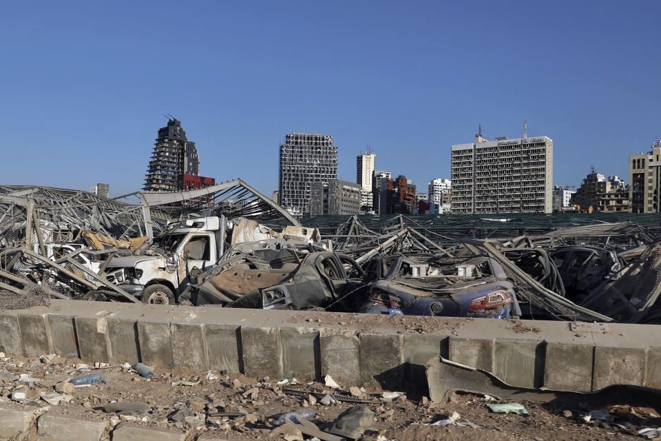 Damaged cars remain at the site of the Aug. 4 explosion that killed more than 180 people, injured thousands and caused widespread destruction in the seaport of Beirut, Lebanon, Monday, Aug. 24, 2020. (AP Photo/Bilal Hussein)