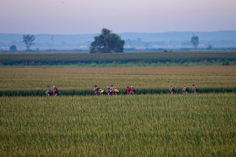 Cyclists make their way along the route to Ida Grove during the first day of RAGBRAI in 2022.