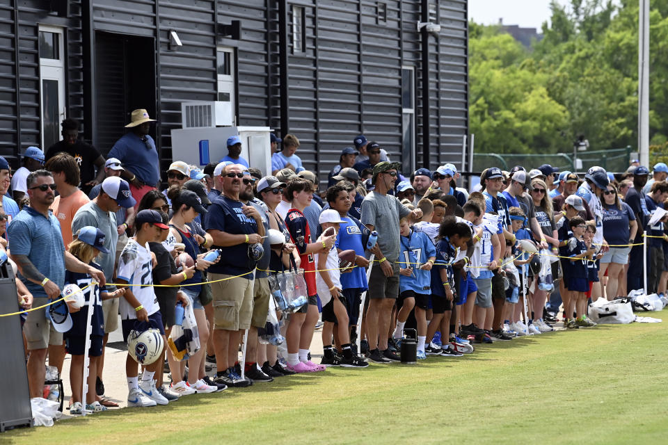 Tennessee Titans fans wait for players to sign autographs after practice at NFL football training camp Saturday, July 29, 2023, in Nashville, Tenn. (AP Photo/Mark Zaleski)