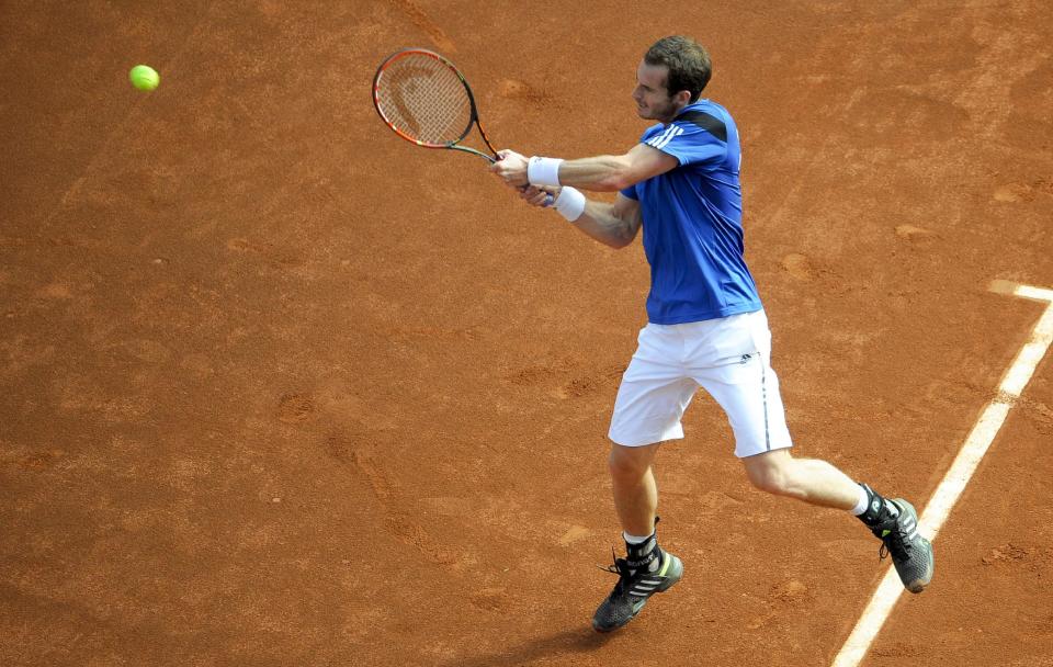 Britain's Andy Murray hits a backhand shot during a match against United States' Sam Querrey at the Davis Cup tennis matches on Sunday, Feb. 2, 2014, in San Diego. (AP Photo/Denis Poroy)