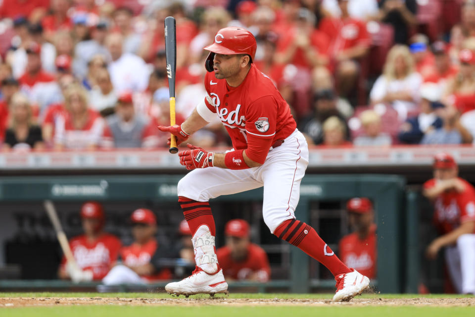 Cincinnati Reds' Joey Votto watches his RBI-single during the sixth inning of a baseball game against the Baltimore Orioles in Cincinnati, Sunday, July 31, 2022. (AP Photo/Aaron Doster)