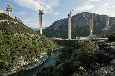 Cement pillars above Moraca river canyon are seen at a bridge construction site of the Bar-Boljare highway in Bioce, Montenegro June 18, 2018. REUTERS/Stevo Vasiljevic