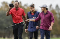 Tiger Woods, left; daughter Sam, center; and son Charlie, right; during the final round of the PNC Championship golf tournament, Sunday, Dec. 17, 2023, in Orlando, Fla. (AP Photo/Kevin Kolczynski)