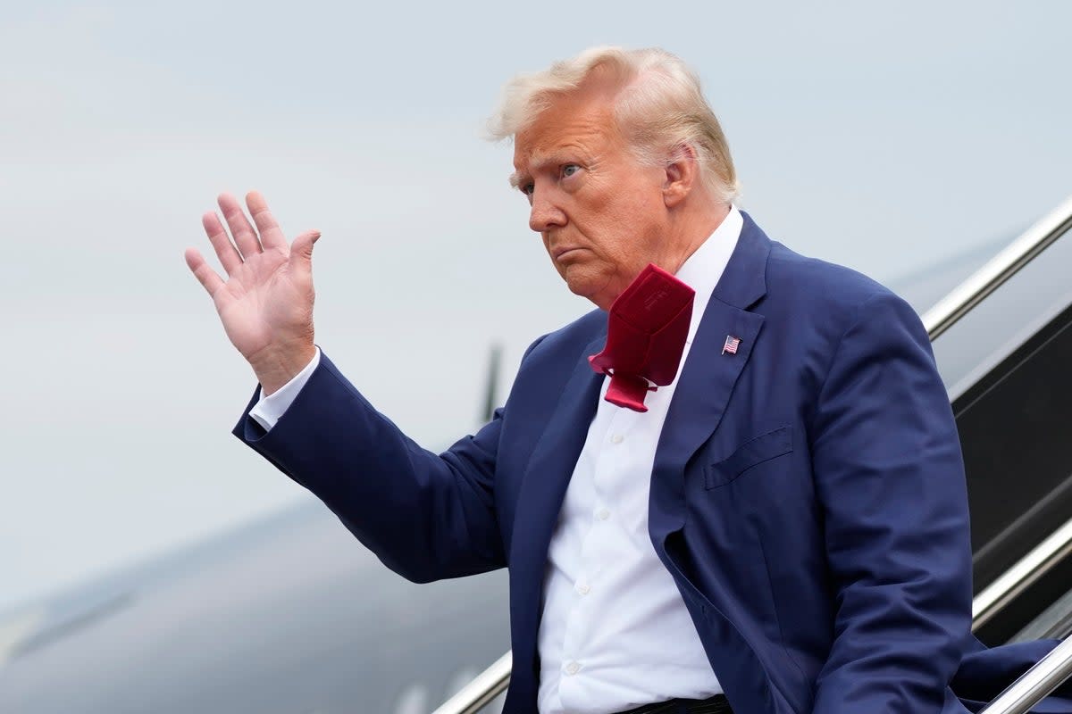 Donald Trump arrives at Ronald Reagan Washington National Airport on Thursday 3 August (AP)