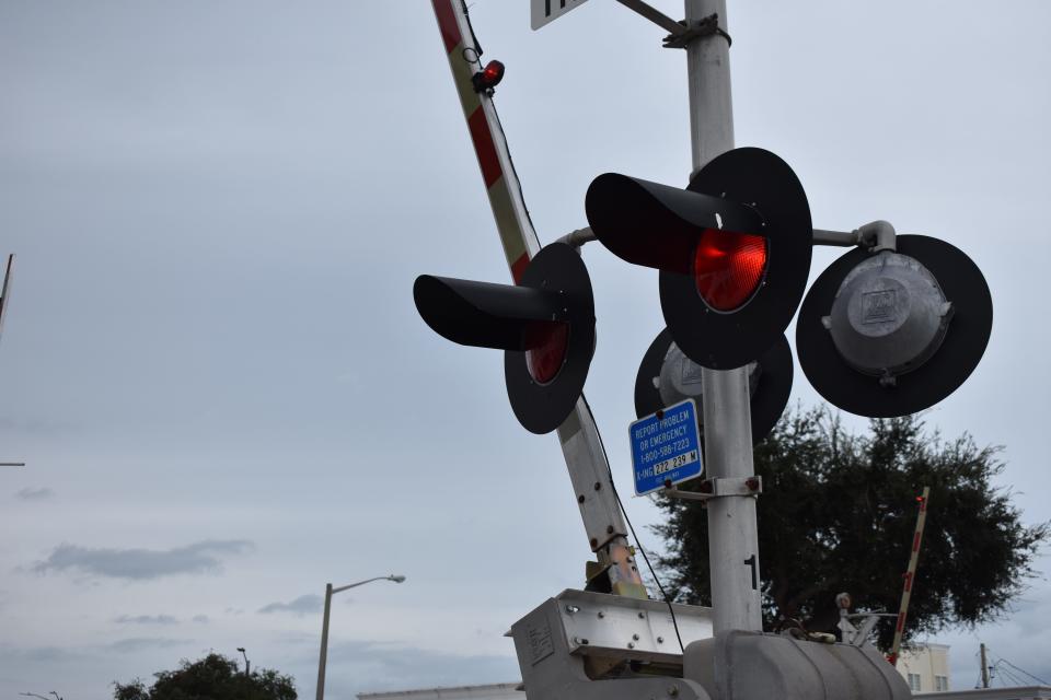 The gates at a triple railroad crossing at Orange Avenue in downtown Fort Pierce, Fla., are pictured Monday, Oct. 9, 2023, the day high-speed rail carrier Brightline increased its Miami-to-Orlando service from 16 to 30 trains daily.