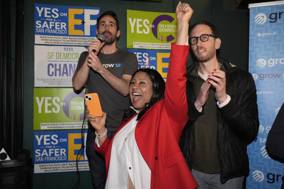 Mayor London Breed celebrates with supporters at an election night party.