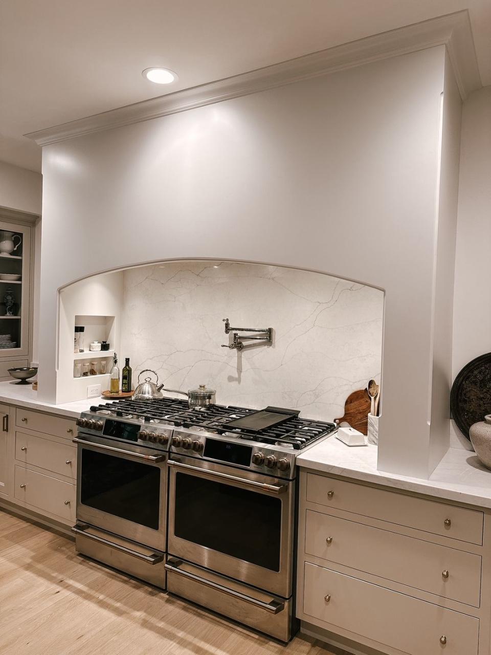 a kitchen with a stove and oven