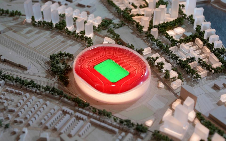 An architect's version of a regenerated Old Trafford district in Manchester, including the new stadium