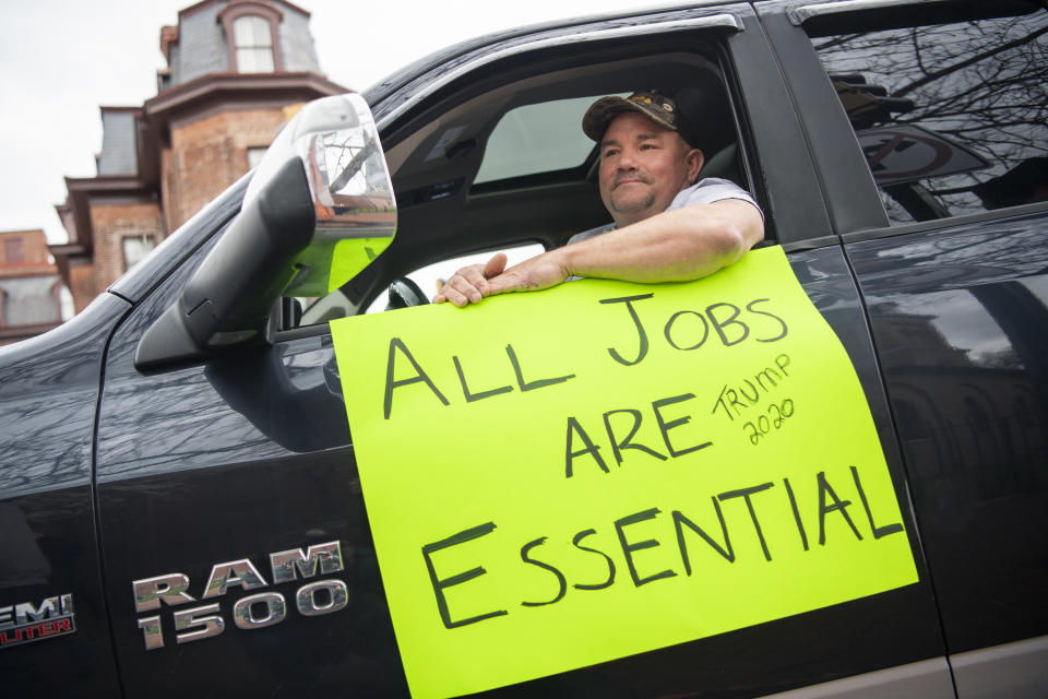 UNITED STATES - APRIL 18: A demonstrator demands that Gov. Larry Hogan (R) lift restrictions that have closed certain businesses in Maryland since the coronavirus outbreak on Church Circle in Annapolis, Md., on Saturday, April 18, 2020. The event titled Operation Gridlock Annapolis, was hosted by the Patriot Picket and Reopen Maryland. (Photo By Tom Williams/CQ-Roll Call, Inc via Getty Images)