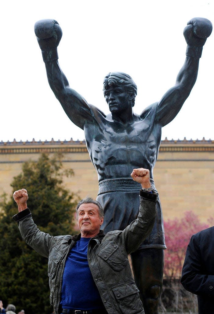 Sylvester Stallone poses in front of the Rocky statue at the Philadelphia Art Museum at a photo op to promote "Creed II" in Philadelphia on Friday, April 6, 2018.