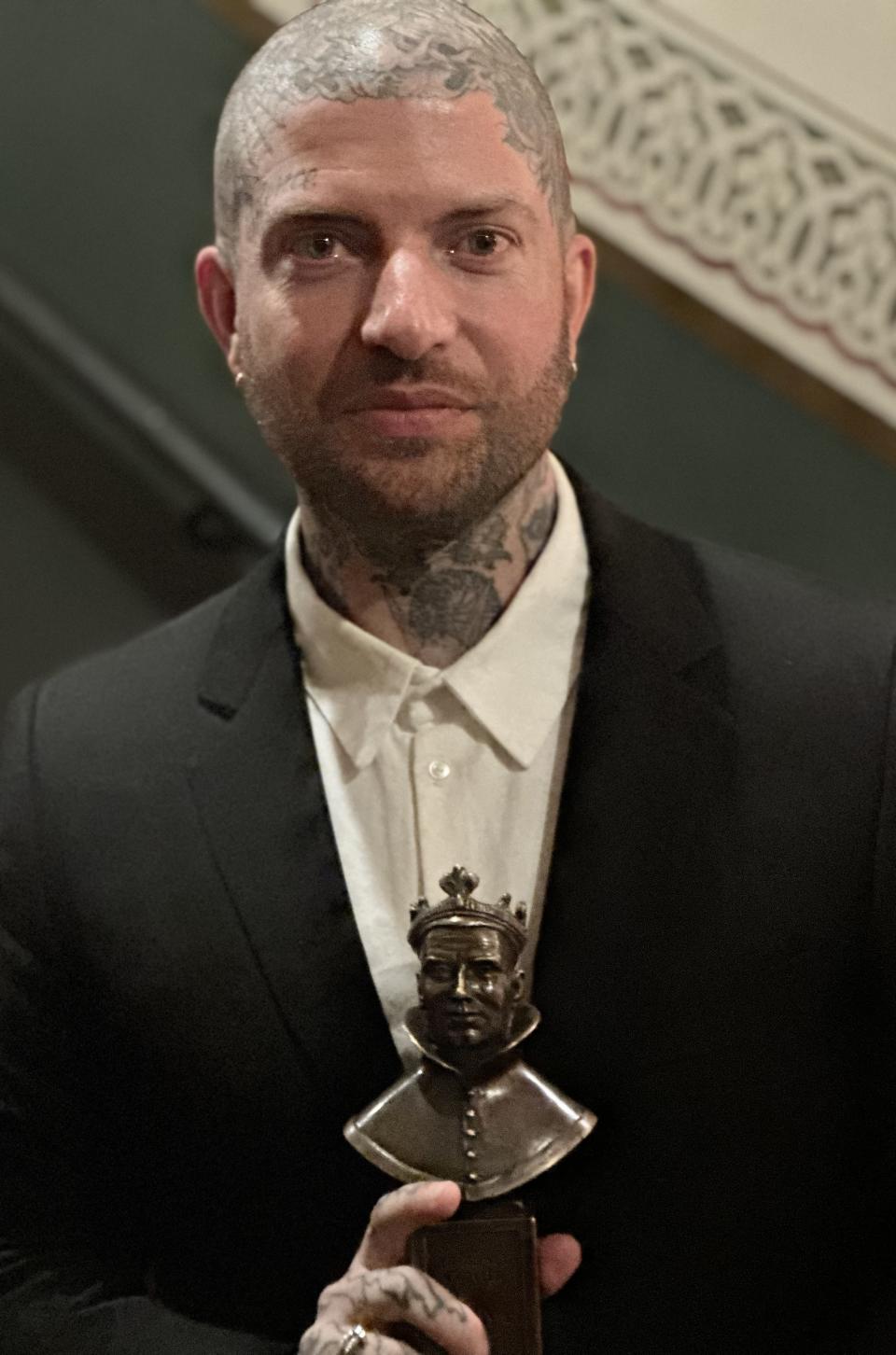 Jamie Lloyd with Olivier trophy for best director. Photo by Baz Bamigboye/Deadline.
