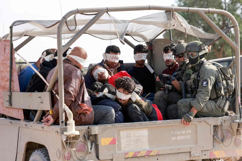 Israel soldiers transfer detained Palestinians out of the Gaza Strip on November 21, 2023, amid ongoing battles between Israel and the Palestinian Hamas movement.