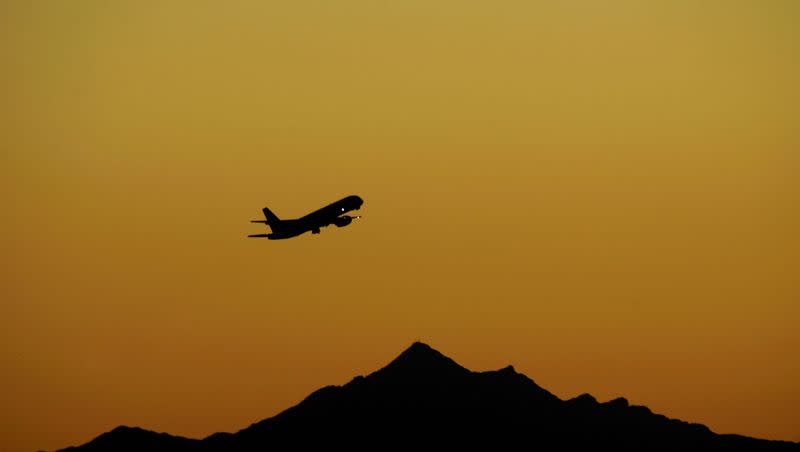 In this photo taken on Feb. 1, 2008, an airplane takes off at sunset from Sky Harbor International Airport, in Phoenix. The number of vacationing Americans will be down this summer, according to a new AP-Gfk Poll, and a third of Americans surveyed said they have already canceled at least one trip this year because of financial concerns. (AP Photo/Matt Slocum)