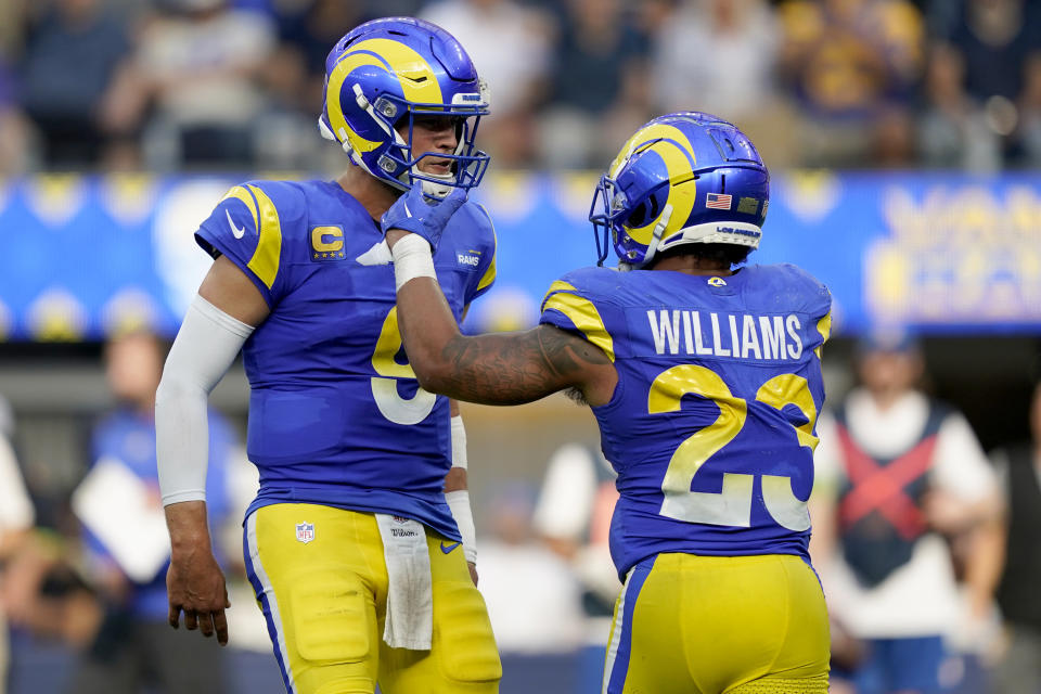 Los Angeles Rams running back Kyren Williams (23) celebrates his rushing touchdown with quarterback Matthew Stafford (9) during the second half of an NFL football game against the Arizona Cardinals Sunday, Oct. 15, 2023, in Inglewood, Calif. (AP Photo/Ryan Sun)