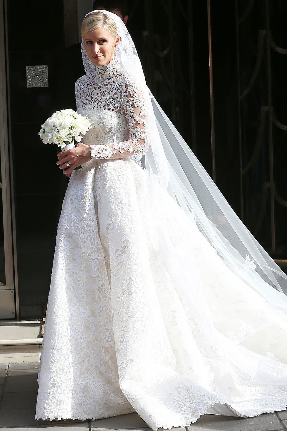 <p>Nicky (sister of Paris!) married her banker hubby in London wearing a beautiful Valentino Haute Couture gown with lace sleeves and crystal detailing. Note the similarity to Kate Middleton's gown? </p>