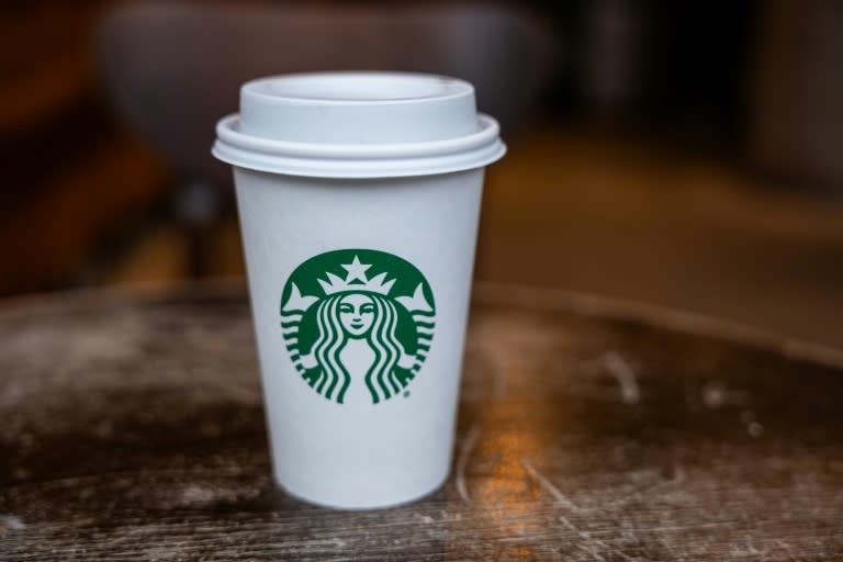 Starbucks reported weaker than expected profits, pointing to lackluster conditions in China and consumer caution in the United States (SPENCER PLATT)