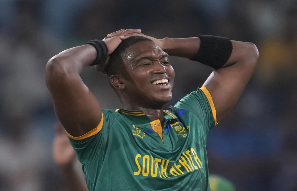 South Africa's Lungi Ngidi reacts after Australia's David Warner was hit on the leg by his bowling during the ICC Cricket World Cup match between Australia and South Africa in Lucknow, India, Thursday, Oct. 12, 2023. (AP Photo/Altaf Qadri)