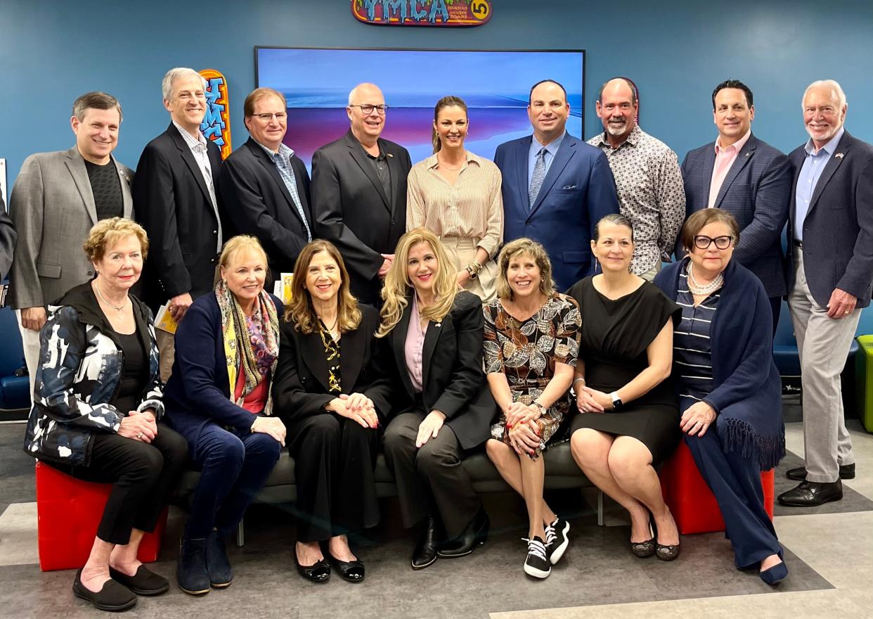 Emmy-winning sports broadcaster Erin Andrews poses with the board members of the YMCA of South Palm Beach County at the organization's Inspiration Breakfast on Wednesday in Boca Raton.