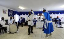 Faithful worship during a church service amid concerns about the spread of coronavirus disease (COVID-19) at the Apostolic Christian Church in Kagiso