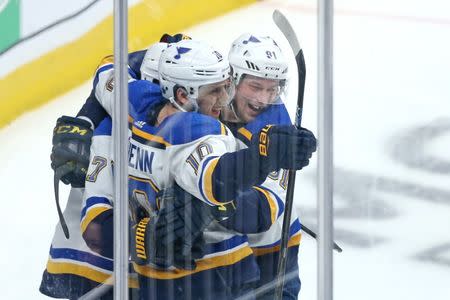 May 19, 2019; San Jose, CA, USA; St. Louis Blues left wing Jaden Schwartz (17) is congratulated by center Brayden Schenn (10) and right wing Vladimir Tarasenko (91) after scoring a goal during the second period against the San Jose Sharks in Game 5 of the Western Conference Final of the 2019 Stanley Cup Playoffs at SAP Center at San Jose. Mandatory Credit: Darren Yamashita-USA TODAY Sports