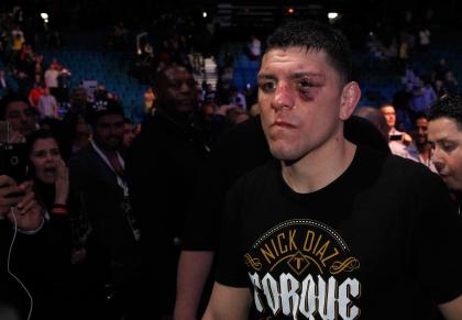 Nick Diaz leaves the arena after losing to Anderson Silva on Saturday. (Getty)