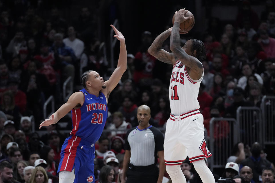 Chicago Bulls forward DeMar DeRozan, right, shoots over Detroit Pistons forward Kevin Knox II during the second half of an NBA basketball game in Chicago, Friday, Dec. 30, 2022. The Bulls won 132-118. (AP Photo/Nam Y. Huh)