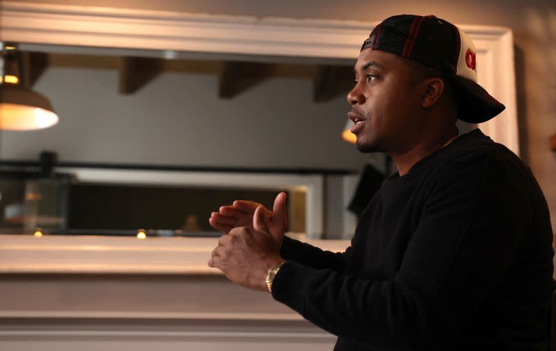Rapper Nas is interviewed at Sweet Chick restaurant in Los Angeles