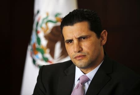 Arturo Henriquez, head of procurement for Pemex, listens during an interview with Reuters at the headquarters of Pemex in Mexico City October 31, 2014. REUTERS/Bernardo Montoya