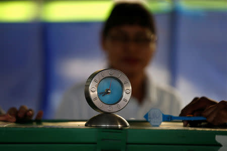 Election worker looks on at a polling station ahead of the general election in Bangkok, Thailand, March 24, 2019. REUTERS/Soe Zeya Tun