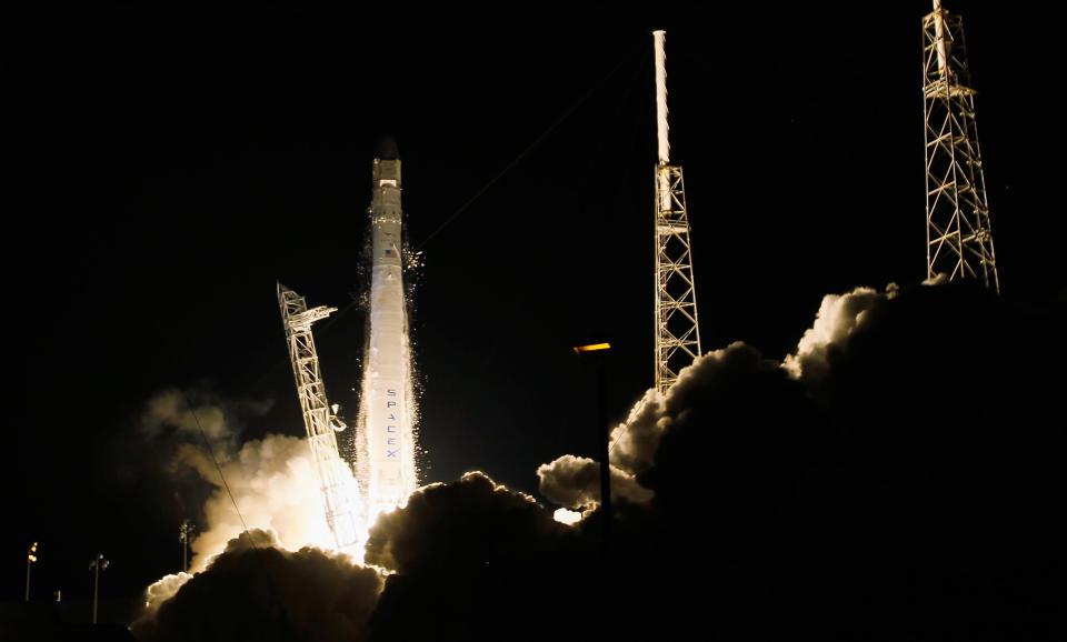 A SpaceX Falcon 9 rocket attached to the cargo-only capsule called Dragon lifts off from the launch pad on October 7, 2012 in Cape Canaveral, Florida. The rocket is bringing cargo to the International Space Station that consists of clothing, equipment and science experiments. (Photo by Joe Raedle/Getty Images)