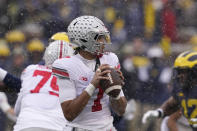 Ohio State quarterback C.J. Stroud (7) looks downfield during the first half of an NCAA college football game against Michigan, Saturday, Nov. 27, 2021, in Ann Arbor, Mich. (AP Photo/Carlos Osorio)