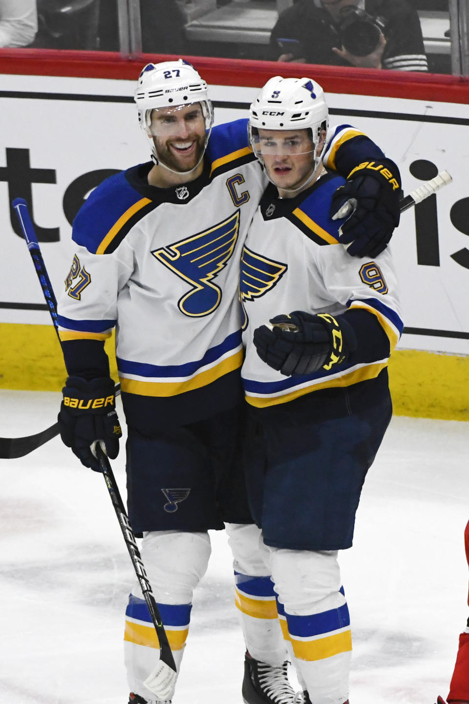 St. Louis Blues defenseman Alex Pietrangelo (27) celebrates with left wing Sammy Blais (9) after Pietrangelo scored a goal against the Chicago Blackhawks during the third period of an NHL hockey game, Sunday, March 8, 2020, in Chicago. (AP Photo/Matt Marton)